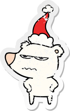 angry bear polar distressed sticker cartoon of a wearing santa hat
