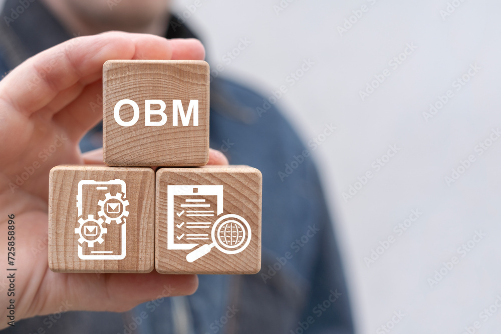 Poster man holding wooden cubes sees text: obm. obm online business management concept. global business str