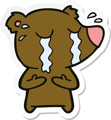 sticker of a cartoon crying bear