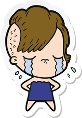 sticker of a cartoon crying girl