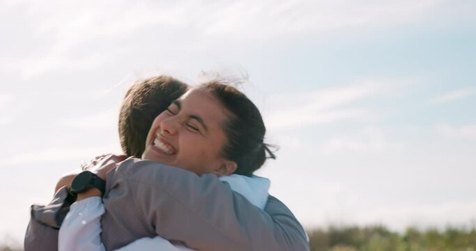 Happy, nature and girl friends hugging for good news, celebration or achievement together. Smile, excited and young women embracing with love, care and friendship in outdoor field at countryside.