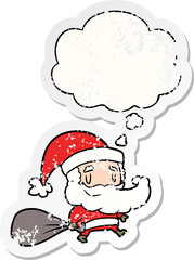 cartoon santa claus with sack and thought bubble as a distressed worn sticker