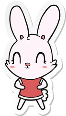 sticker of a cute cartoon rabbit in dress