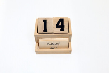 14th of August wooden perpetual calendar. Shot close up isolated on a white background