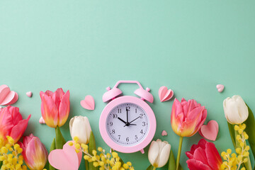 Time to celebrate International Women's Day. Top view photo of alarm clock, hearts, tulips, mimosa on turquoise background with space for festive text - obrazy, fototapety, plakaty