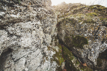 Texture cracked rock formation rock in the wild. Rocky cliff. Abstract Stone texture. Steep cliff of high mountain. Nature background, geological structure. Marble rocks in the wild. Stone Pattern