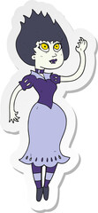sticker of a cartoon vampire girl waving
