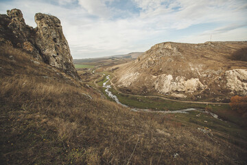 landscape with rocky mountains formation rock in the wild. Rocky cliff. Steep cliff of high mountain. Nature background, geological structure. Marble rocks in the wild. Stone Pattern