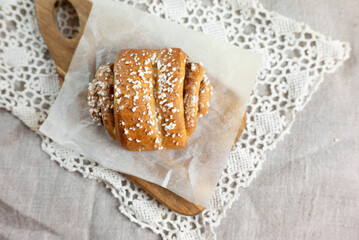 Traditional finnish cinnamon and cardamon rolls, korvapuusti. Home made buns with milk for breakfast. Hight key. 