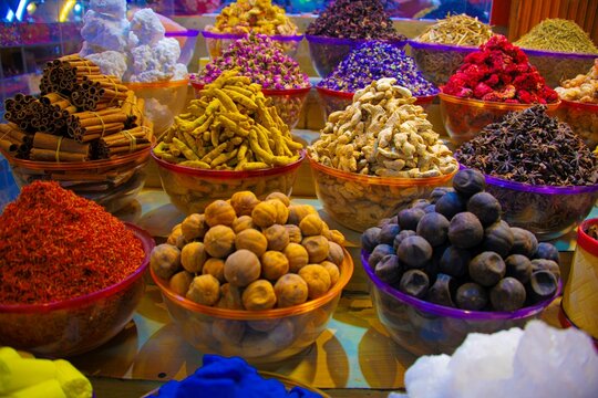 big variation of spices in baskets at the old Souk in Dubai in different colors