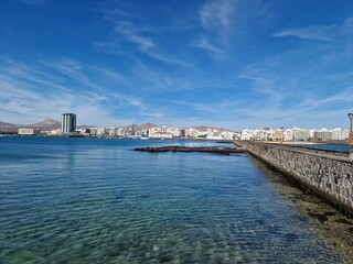 Walking the Arrecife, Lanzarote seaside promenade offers a blend of coastal charm and Canarian architecture.