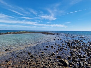 Walking the Arrecife, Lanzarote seaside promenade offers a blend of coastal charm and Canarian architecture.