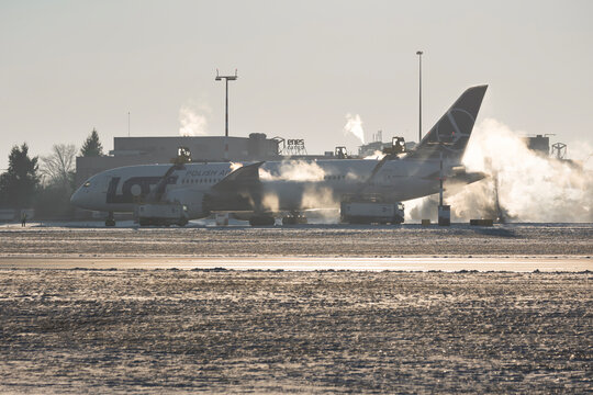 PRAGUE - January 21, 2024: LOT Polish Airlines Boeing 787-8 Dreamliner REG:SP-LRA at Vaclav Havel Airport Prague.Deicing the aircraft before the flight.