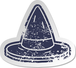 distressed old sticker of a witches hat