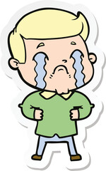 sticker of a cartoon man crying