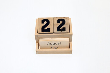 22nd of August wooden perpetual calendar. Shot close up isolated on a white background