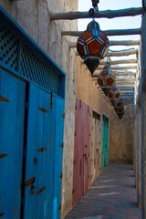 oriental lamps and closed wooden doors at the historic old district of Dubai