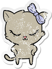 distressed sticker of a cute cartoon cat with bow