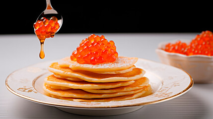 Russian pancakes with red caviar in a plate, on a white table, spoon with red caviar.