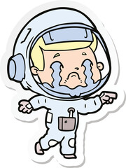 Obraz premium sticker of a cartoon crying astronaut