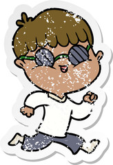 distressed sticker of a cartoon boy wearing sunglasses and running