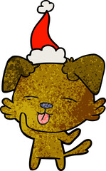 textured cartoon of a dog sticking out tongue wearing santa hat