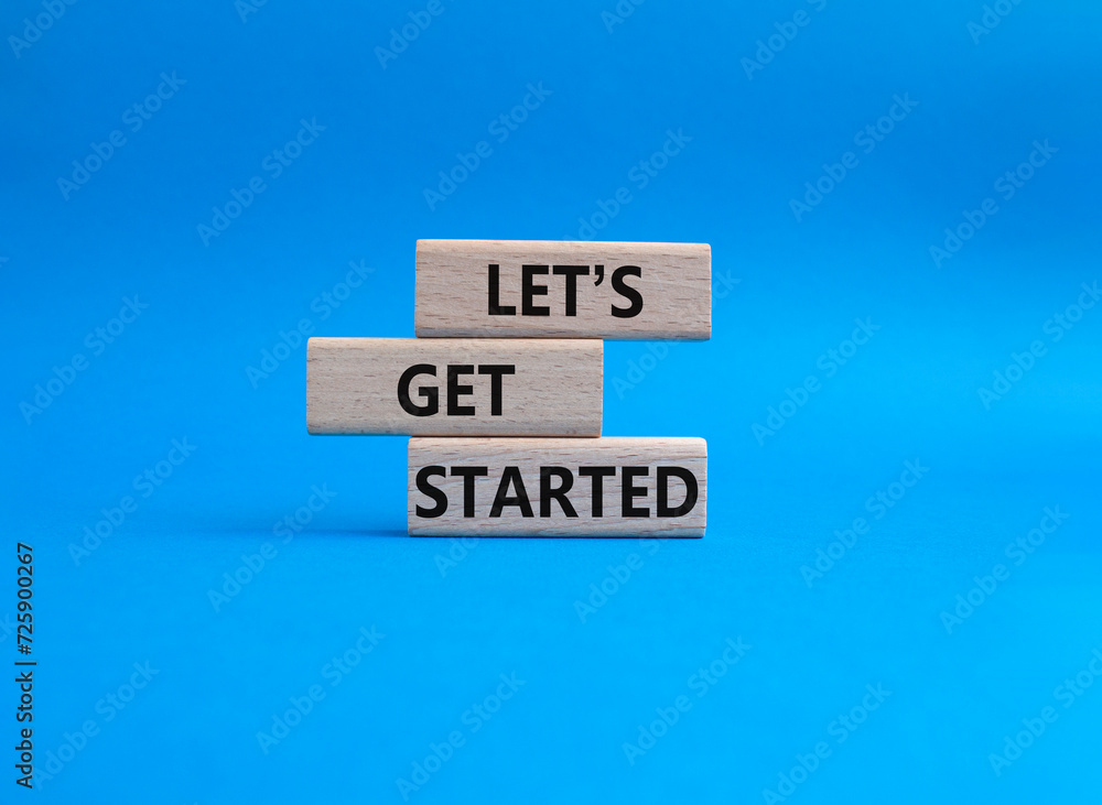 Canvas Prints lets get started symbol. concept words lets get started on wooden blocks. beautiful blue background.