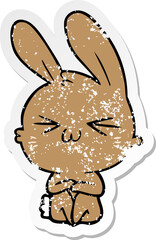 distressed sticker of a cute cartoon rabbit