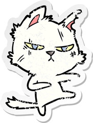 distressed sticker of a tough cartoon cat