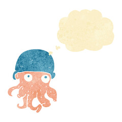 cartoon alien head wearing hat with thought bubble