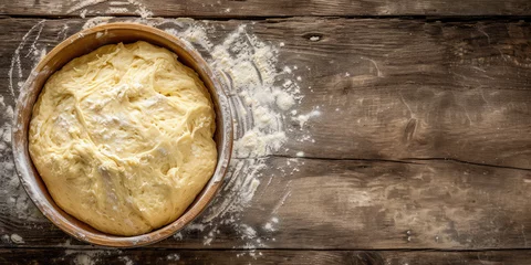 Keuken spatwand met foto Artisanal Yeast Dough, copy space. A close-up image of freshly kneaded yeast dough resting in a bowl, ready for baking, set on a kitchen countertop. © dinastya