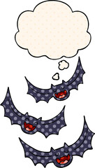 cartoon vampire bats and thought bubble in comic book style
