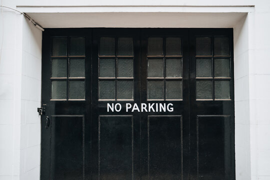 No parking sign on a garage door of a house in London, UK.