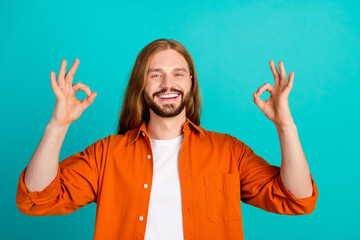 Portrait of young optimistic blond hair guy loves christianity religion showing two okey symbols...