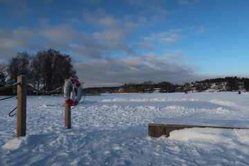 Fototapeta na wymiar Winterday by a lake in Älta near Stockholm in Sweden