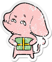 distressed sticker of a cartoon elephant with gift remembering