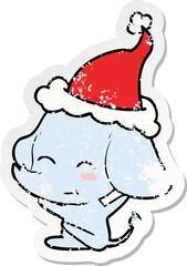 cute distressed sticker cartoon of a elephant wearing santa hat