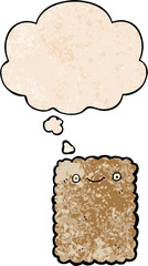 cartoon biscuit and thought bubble in grunge texture pattern style