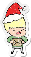 distressed sticker cartoon of a stressed man wearing santa hat
