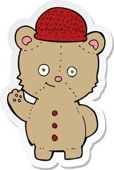 sticker of a cartoon bear in hat