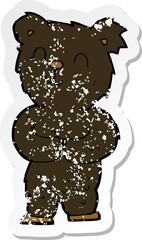 retro distressed sticker of a cartoon happy little black bear