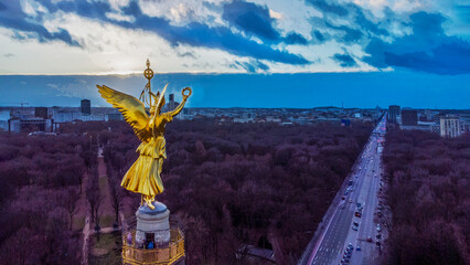 Aerial view on Victory column with observation desk on top of it,  sunbeams of sunset,  winter...