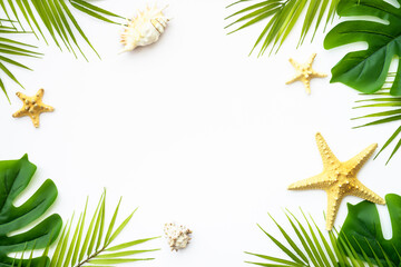 Tropical leaves and sea shells on white background. Summer flat lay background with copy space.