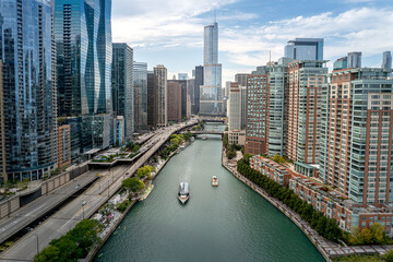 Aerial view of downtown Chicago, Illinois, USA. Boats moving up and down the Chicago River....