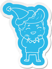 Fototapeta premium cartoon sticker of a man laughing wearing santa hat
