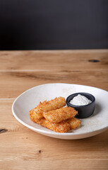 Breaded chicken nuggets with garlic sauce
