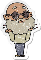 distressed sticker of a cartoon curious man with beard and sunglasses