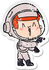 distressed sticker of a happy cartoon astronaut pointing