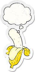 cartoon banana and thought bubble as a distressed worn sticker