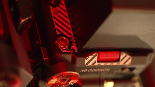 Close-up of Red Cinema Digital Camera 6k back video output and power ports, vertical video 